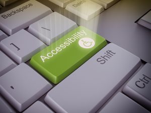 Keyboard with a green key with the word "Accessibility"